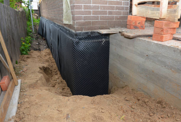 Happy homeowners after waterproofing job in Moores Hill